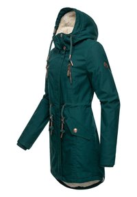 Dark green parka jacket with a faux fur-lined hood, adjustable drawstrings, zippered pockets, and metallic hardware accents.