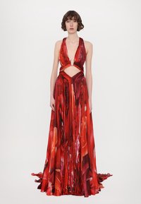 Red floor-length dress with a deep V-neck, cut-out detailing at the waist, and floral pattern, made from flowy fabric with a smooth texture.