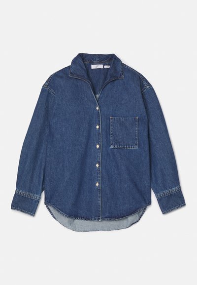 Denim shirt in dark blue featuring a collar, button closure, single chest pocket, and long sleeves with a curved hem. Soft texture.