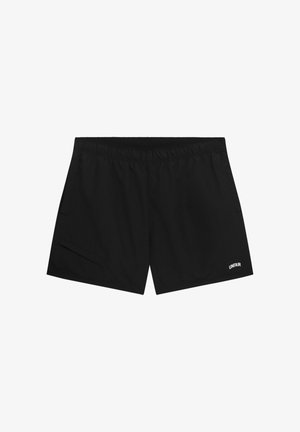 Schwarze Sportshorts mit elastischem Bund und kleinem weißem "UNFAIR"-Logo am unteren rechten Bein.