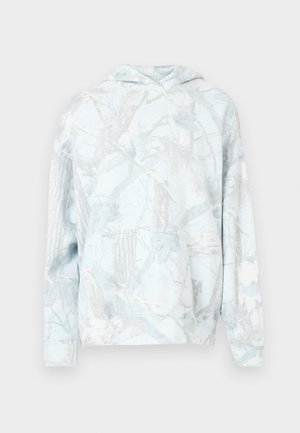 Svetlo modra kapucar s sivo vzorcem drevesnih vej. Sprednji žep v stilu kenguruja, rebrasti manšeti in rob. Mehka, teksturirana tkanina.