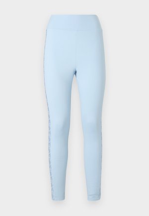 Light blue leggings with a high waistband, made from stretchy material. Features a decorative floral pattern along the side seams.