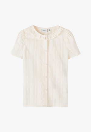 Blouse à manches courtes couleur crème avec boutons sur le devant et petit col à volants, conçue pour un tout-petit de 2 à 3 ans.