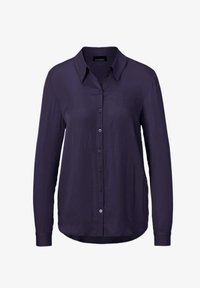 Navy blue long-sleeve shirt with a collar, button front closure, and smooth texture. Features a curved hem and subtle sheen on fabric.