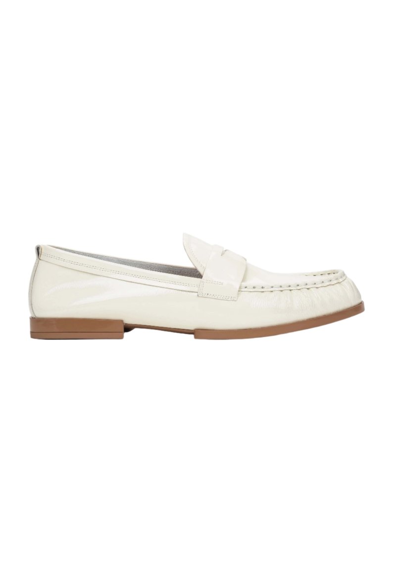 White leather loafer shoe with flat brown sole, stitched detailing along the toe, and a small, decorative strap across the vamp.