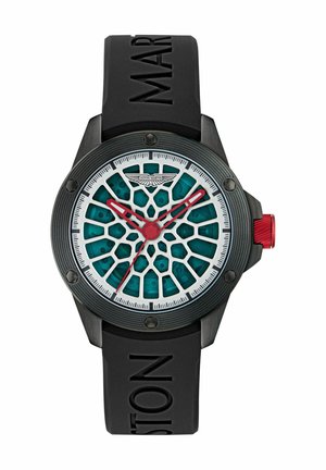 Must Black rubber rihmaga kell, millel on tekstureeritud must bezel. Kellal on valge meshtariku muster ja teal põhivärv, punaste käte ja kroonide aktsentidega.