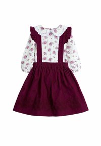 Abito a fantasia floreale con parte superiore bianca caratterizzata da maniche a sbuffo e una gonna in corduroy bordeaux con ricami floreali.