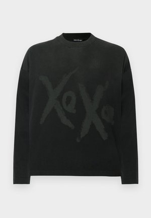 Zwart T-shirt met lange mouwen van katoen, met een grote "Xo"-print in een iets lichtere tint, ronde halslijn en een losse pasvorm.