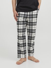 Svart och vit rutiga flanellbyxor med rak passform, med sidofickor och elastisk midja. Mjuk textur, avslappnad look.