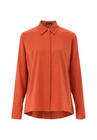 Long-sleeve collared shirt in a solid rust color, made from a textured fabric with a straight cut and a curved hemline. No visible hardware.