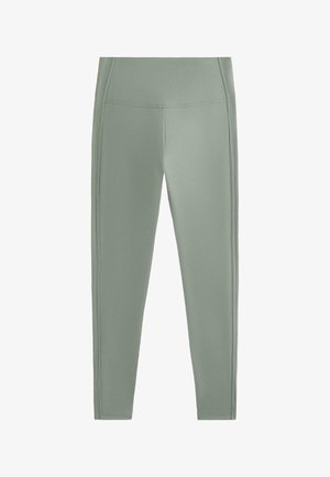 High-waisted, seamless light green leggings with side stitching, designed for activewear or casual use.