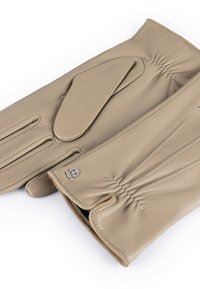 Beige leather gloves with gathered detailing, sleek design, and a silver logo accent. Smooth texture with reinforced stitching.