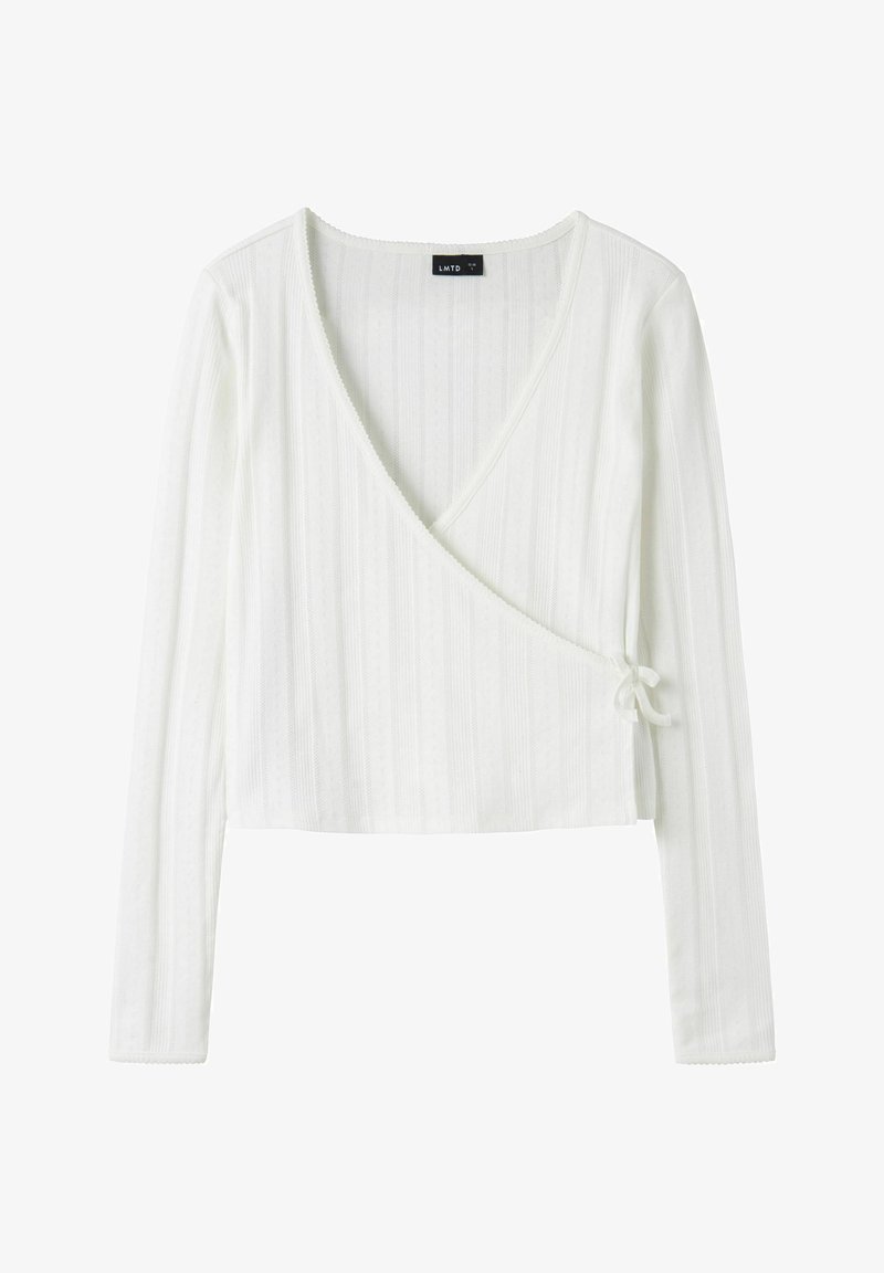 Haut à manches longues blanc côtelé, à enfiler, avec un col en V profond et une fermeture nouée sur le côté, longueur raccourcie et texture subtile à rayures verticales.