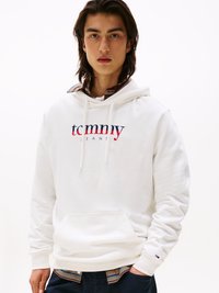 Sudadera blanca con el logo de "tommy jeans" en azul marino y rojo. Tela suave, capucha con cordón, bolsillo frontal, puños acanalados, superpuesta a una camisa de cuadros.
