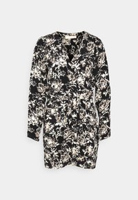 Black and white printed dress with long sleeves, a wrap design, and a tied waist. Features a floral pattern with light accents.