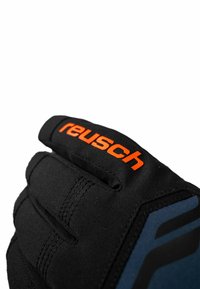 Zwarte sporthandschoen van textuurstof met een oranje "Reusch" logo en blauwe accenten, voorzien van versterkte stiksels en een verstelbare band.