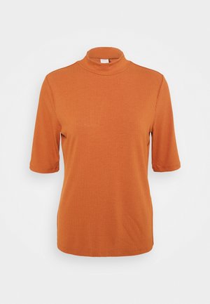 Haut côtelé manches courtes orange rouille avec col montant présenté sur fond blanc uni.