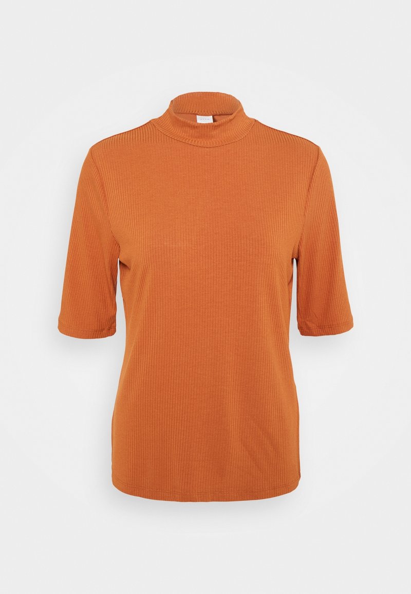 Haut côtelé manches courtes orange rouille avec col montant présenté sur fond blanc uni.