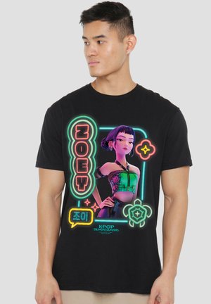 Man wearing black T-shirt featuring colorful neon-style graphic of female character with short purple hair and the word "ZOEY."