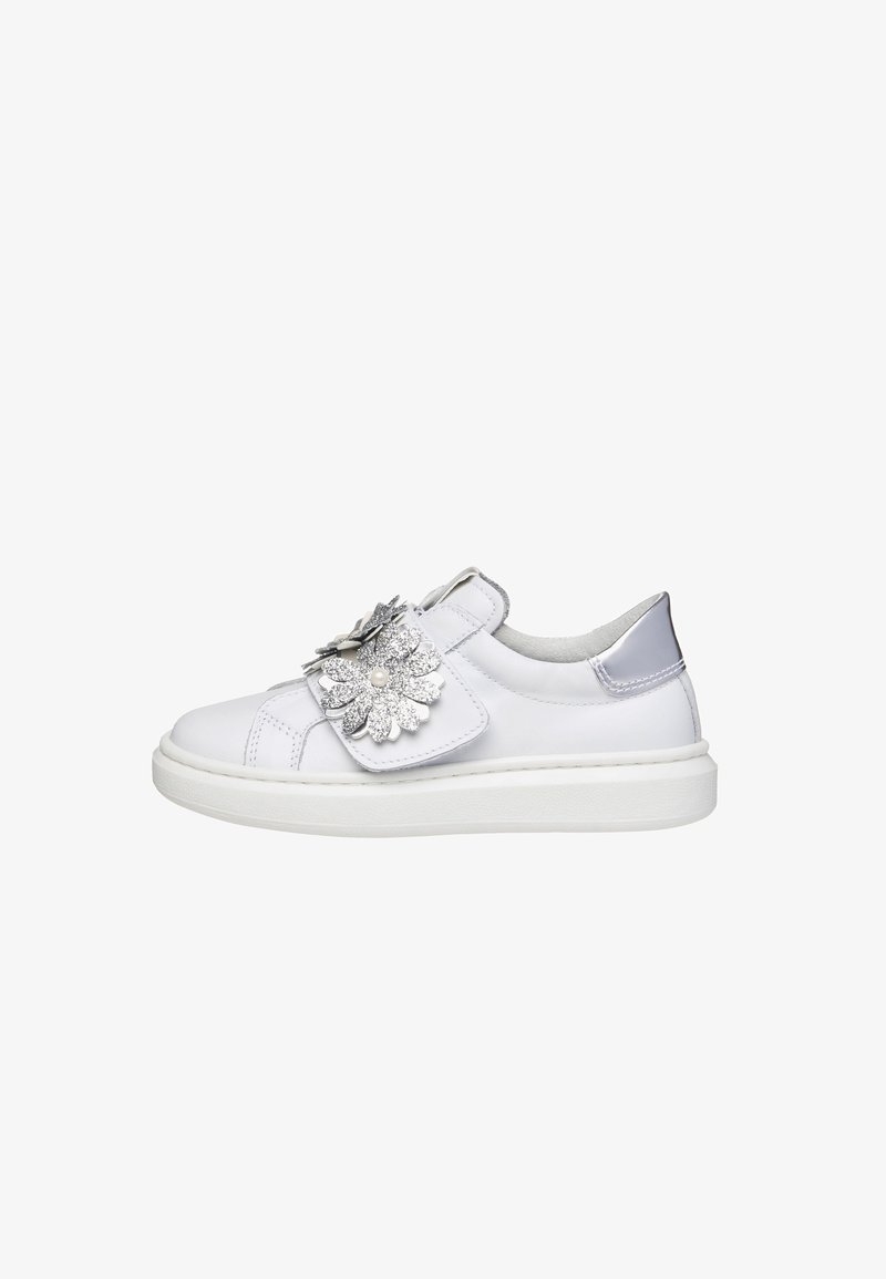 White leather sneaker with silver accents, floral embellishment on the strap, and a textured white sole. Rounded toe and soft interior.