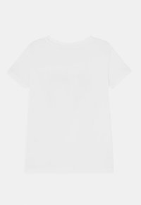 T-shirt de algodão branco com decote redondo, mangas curtas e corte reto. Sem padrões ou adornos visíveis nas costas.