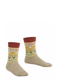 Skarpety z dzianiny z brązowym ściągaczem, z beżowym ciałem ozdobionym żółtymi i zielonymi wzorami kwiatowymi oraz geometrycznymi akcentami w białym i czerwonym kolorze.
