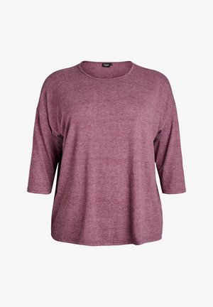 Top dalle linee morbide e a tre quarti di manica in mauve tenue, realizzato in un tessuto a maglia texturizzata; presenta un ampio scollo e un orlo curvato.