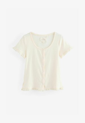 Top a maniche corte di un leggero color crema, con scollatura rotonda, chiusura a bottoni e bordi arricciati sulle maniche e sull'orlo. Tessuto morbido e testurizzato.