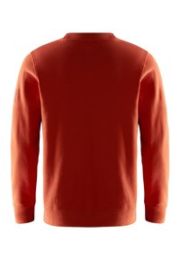 Sweat-shirt à col rond couleur rouille avec manches longues, vu de dos, présentant des poignets et un ourlet côtelés ainsi qu'un petit emblème près de l'encolure.