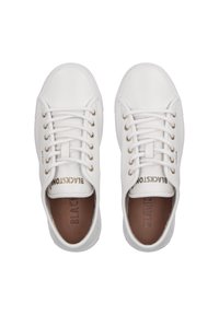 White sneakers with a smooth leather finish, gold eyelets, and flat laces. Interior features a brown insole with embossed brand text.