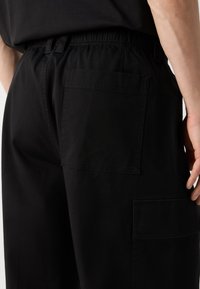 Calvin Klein Jeans REGULAR STRAIGHT  - Kapsáče - black