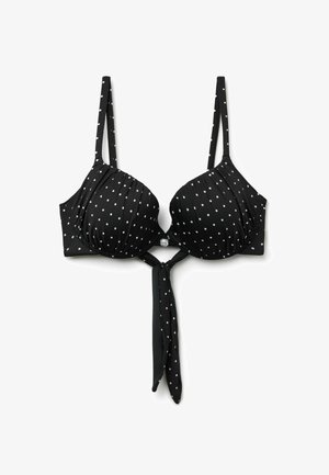Zwarte bikinitop met witte stippen, gevoerde cups, verstelbare bandjes en een voorgeknoopte knoop die onder de sluiting hangt.