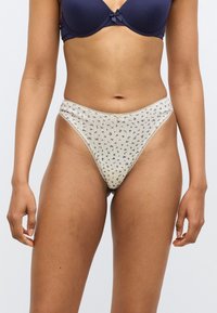 Κρεμιζέρ κιλότα με λουλουδάτο σχέδιο και ευαίσθητη δαντέλα, με απαλό, ελαστικό ύφασμα και χαμηλή μέση.