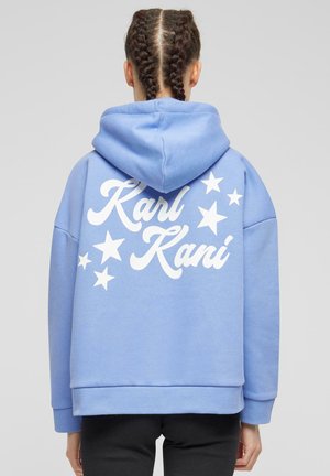 Light blue hoodie with a loose fit, featuring white text "Karl Kani" and star graphics on the back. Made of soft fabric with a hood.