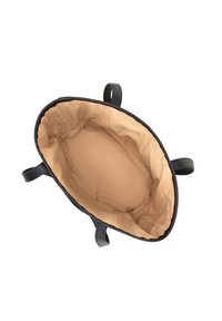 Black leather tote bag with beige fabric interior, viewed from above showing empty spacious main compartment and leather handles.