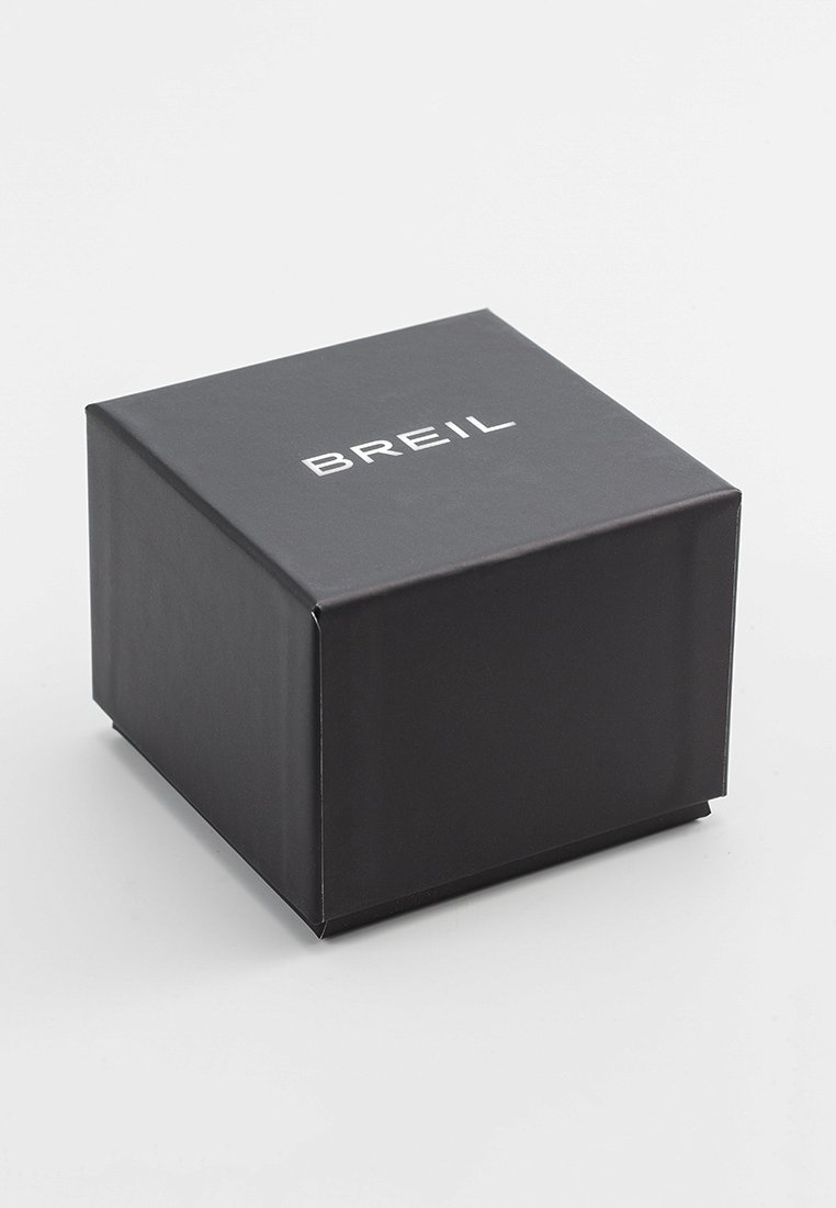 Caja de cartón negra con forma cuadrada, que presenta el logo en relieve "BREIL" en la superficie superior. Textura suave, diseño minimalista.