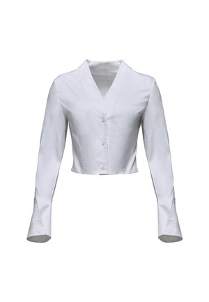 Camicia bianca corta in tessuto morbido, con maniche lunghe e polsini a campana e scollatura a V. Bottoni lungo il davanti.