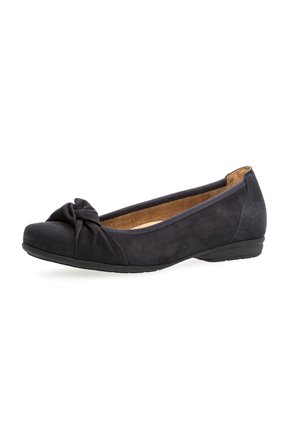 Black suede flat shoe with a rounded toe, featuring a knotted detail at the front and a low rubber heel for comfort.