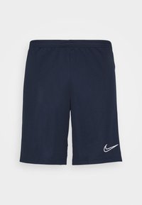 Mörkblå sportshorts i lätt tyg, med elastisk midja och en vit Nike-logotyp på nedre högra sidan.
