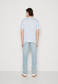 Lacoste Basic póló - bleu clair
