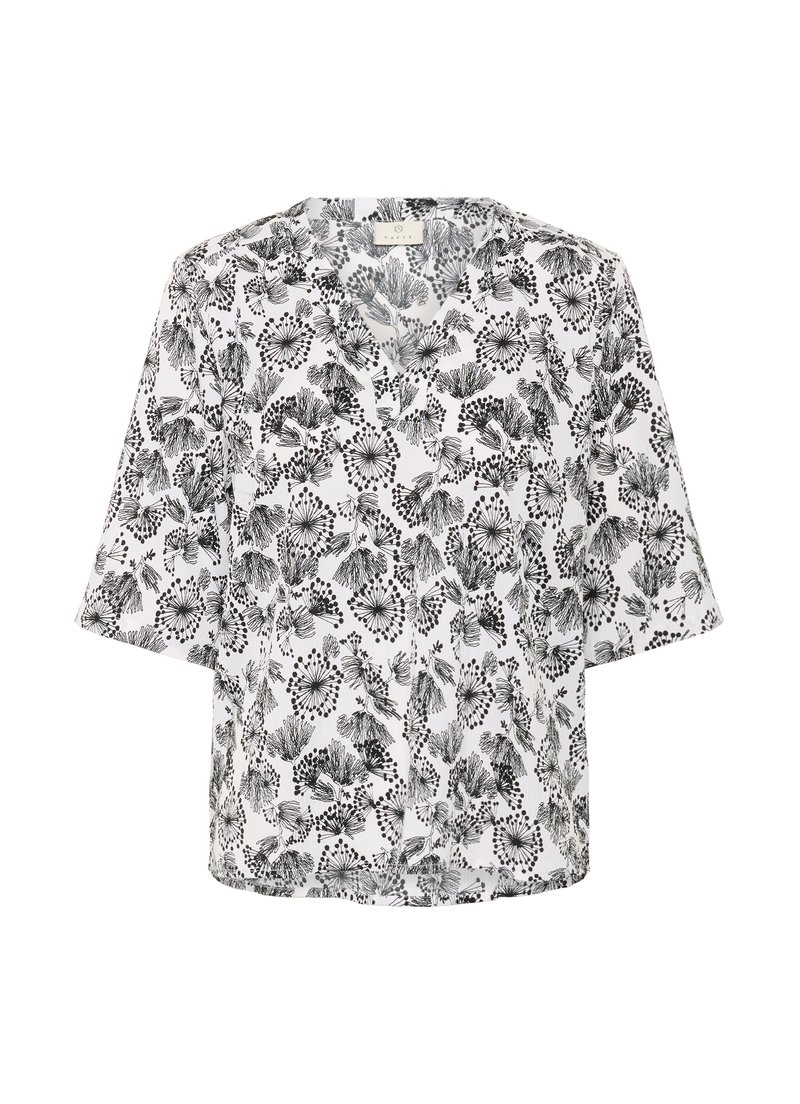 Blouse blanche avec motif floral abstrait noir et manches trois-quarts, présentée sur un fond blanc uni.
