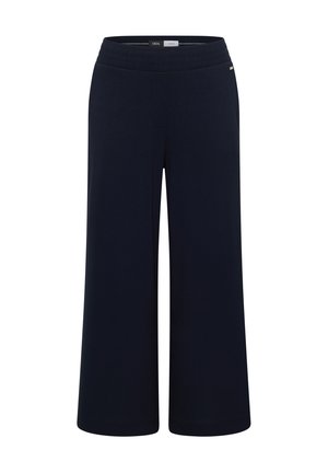 Pantalones azul marino de pierna ancha con cintura elástica, talle medio y pequeña etiqueta metálica con logo en el lado derecho.