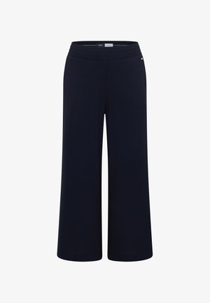 Pantalon bleu marine à jambes larges avec ceinture élastique, coupe taille moyenne et petite étiquette logo en métal sur le côté droit.