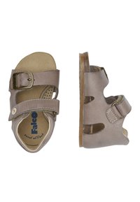 Bruna lädersandaletter med tvåjusterbara remmar, spänne och urtagna detaljer. Mjuk fotbädd med blå och beige foder. Platt sula.