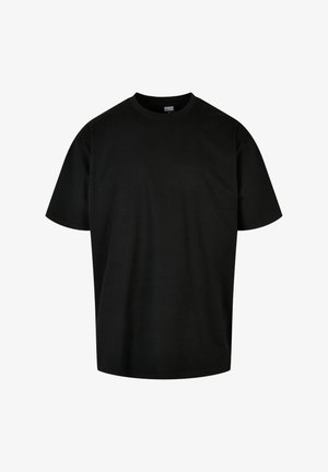 Černé bavlněné tričko s kulatým výstřihem a krátkými rukávy. Má volný střih a hladkou texturu. Žádné viditelné vzory ani akcenty.