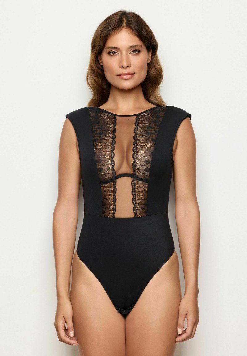 Black one-piece swimsuit with a lace front panel, cap sleeves, and high-cut legs. The design features a sheer lace insert and scalloped edges.