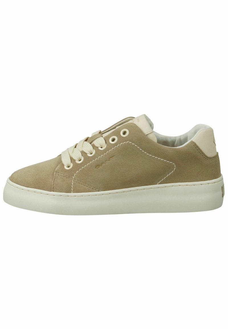 Beige suede sneakers with white rubber soles, round toe, and beige laces. Features a smooth texture and minimalistic design.