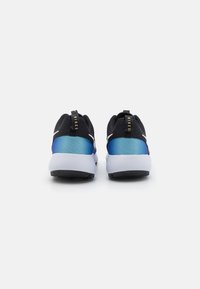 Black athletic shoes with a blue gradient accent, featuring a textured design and rubber soles, displayed from the back. Gold logo detail visible.
