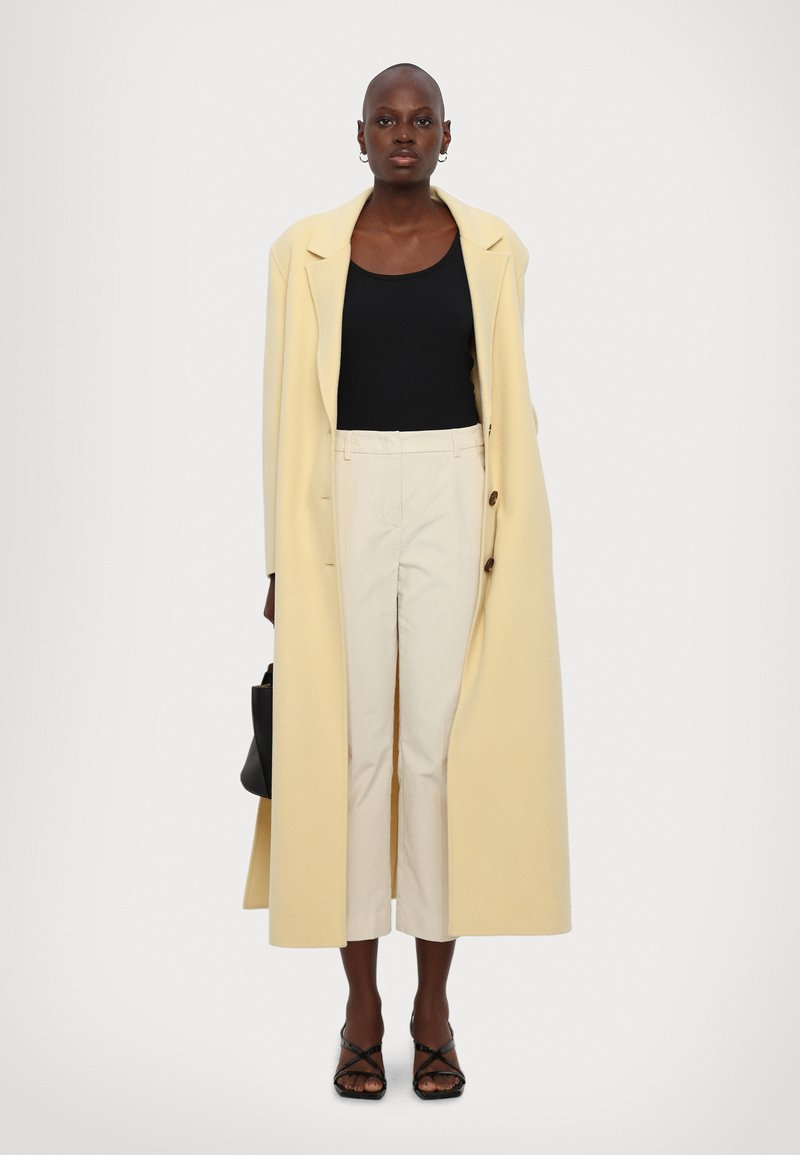 Manteau mi-long laine mélangée beige pour femme | Claudie Pierlot Manteau mi-long laine mélangée beige pour femme | Claudie Pierlot