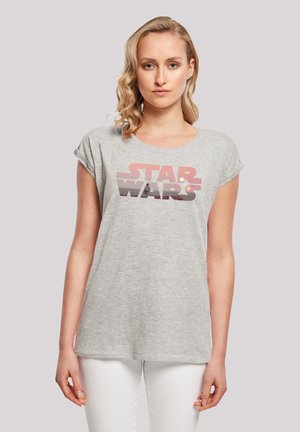 Graues Kurzarm-T-Shirt mit einem Retro-Style "STAR WARS"-Grafik in rot, rosa und braunen Tönen. Weicher Stoff mit entspannter Passform.
